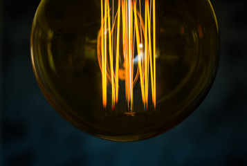 Beautiful women hand on Edison type bulbs