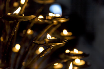 ighted candles in one of the temples