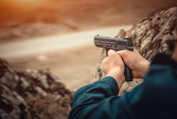man with pistol hiding and waiting for attack. Ambush concept.