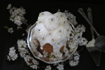 Traditional easter cake with marshmallows and blooming flowers