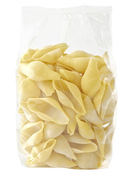 raw uncooked italian conchiglie jumbo shell pasta in plastic bag isolated