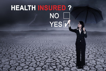 Business woman with text of health insured