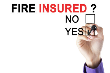 Businessman's hands approving fire insured