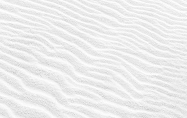 Wavy texture of white sand. Abstract background image