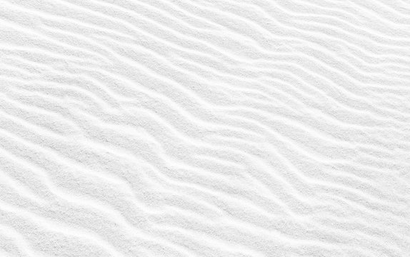 Wavy texture of white sand. Abstract background image