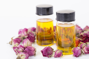 Obraz na płótnie Canvas Rose essential oil, rose buds for body care.