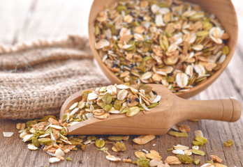 Cereal in a wooden spoon on a table