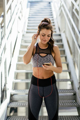 Woman in sport wear using mobile phone
 