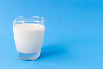 Glass of milk on blue background, food and drink for healthy concept