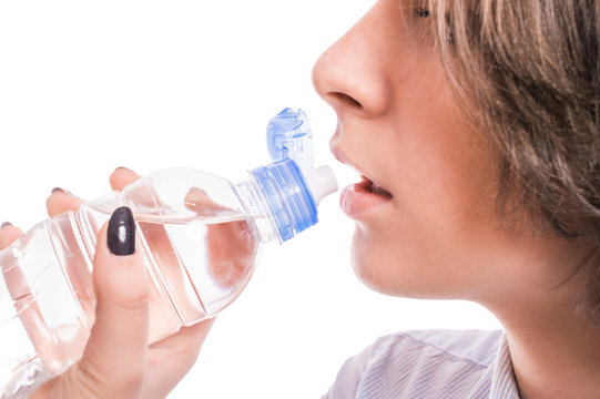 Woman is drinking water on a white background