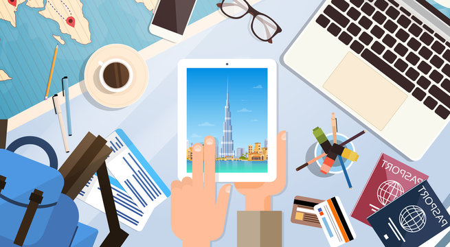Hand Hold Tablet Computer With Dubai Skyline Panorama, Traveler Workplace With Passports Top Angle View Flat Vector Illustration