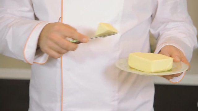 Chef putting cheesse in pan