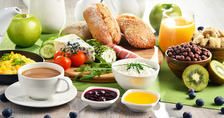 Breakfast served with coffee, cheese, cereals and scrambled eggs