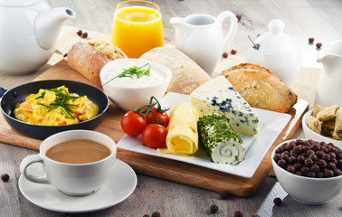 Breakfast served with coffee, cheese, cereals and scrambled eggs