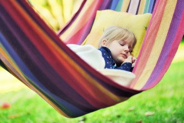 Child sleep in hammock.