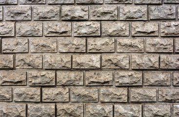 Facing a decorative brick pale yellow in color