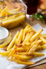 crispy french fries pile with sauce