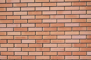 Background of red facing bricks. Close up.