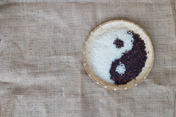 Yin Yang sign with black rice and jasmine white rice