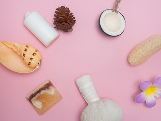 Fototapeta na wymiar Aromatherapy product Spa set ,candle ,soap,coconut,flower,shell, massage with pink color background .