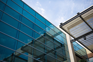Office buildings with modern corporate architecture - business and success concept, blue sky, windows
