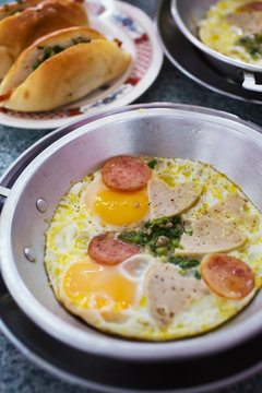 fried eggs with preserved pork sausage,asian breakfast