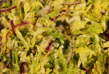 Close-up of savoy cabbage salad with onion