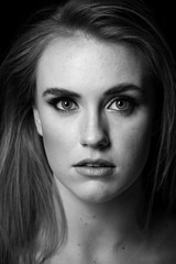Fototapeta premium red head model with an edgy personality looking sexy in a dark studio with edgy lighting