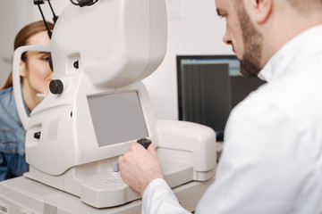 Handsome bearded man using the joystick