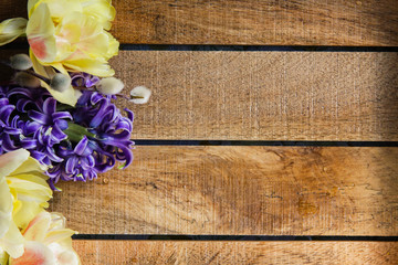 Easter wooden background with flowers  and willow 11