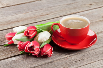Colorful tulips bouquet and coffee cup