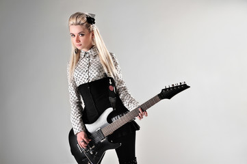 Fototapeta na wymiar Beautiful blonde girl with electric guitar