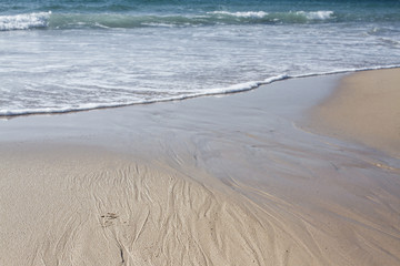 Summer sun blue sky ocean sand desert footprints