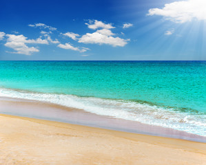 Blue sea and white sand beach in blue sky