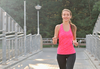 Woman running on bridge