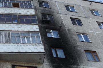 Fototapeta na wymiar traces of a fire at a residential high-rise building