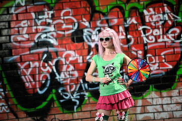 Obraz na płótnie Canvas Girl on graffiti wall background