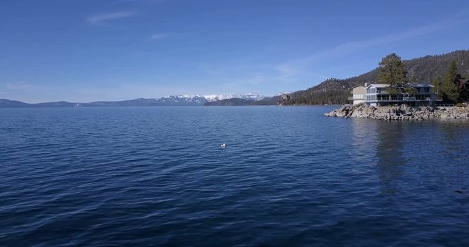 Flying over the surface of Lake Tahoe and then vertical ascent