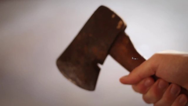 B Horror VHS Tape Concept - Man holding hatchet in dark environment