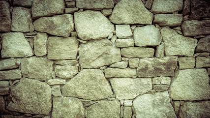 Stone wall texture background. Vintage filter.