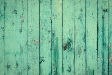 Old rural wooden wall in light turquoise color, detailed plank photo texture. Natural wooden building structure background.
