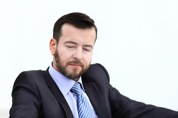 Happy businessman is working in his office.