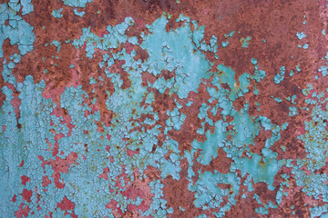 Blue cracked painting on metal surface