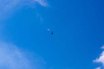Naklejka na ściany i meble dropping parachutists from a helicopter