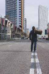 Young man standing alone in the street