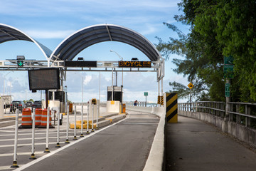 Bicycle lane signage on street for special bicycle road on Rickenbacker causeway for Key Biscayne. Near the ocean and Virginia Key. Miami. Florida. USA. Miami neighborhood.