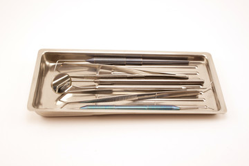 Set of dental tools for teeth care in the tray.