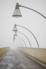 bridge over Vistula river in Krakow in heavy fog.