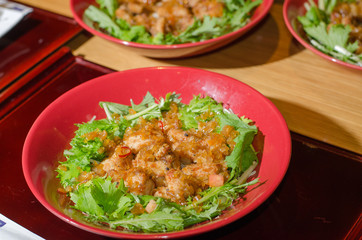 Chicken fried and salad mix in dish