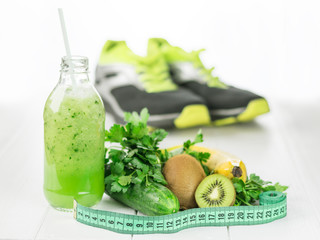 Bottle cucumber smoothie with kiwi and parsley.